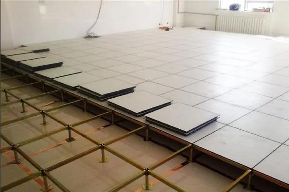Anti-static raised floor panels in a data center