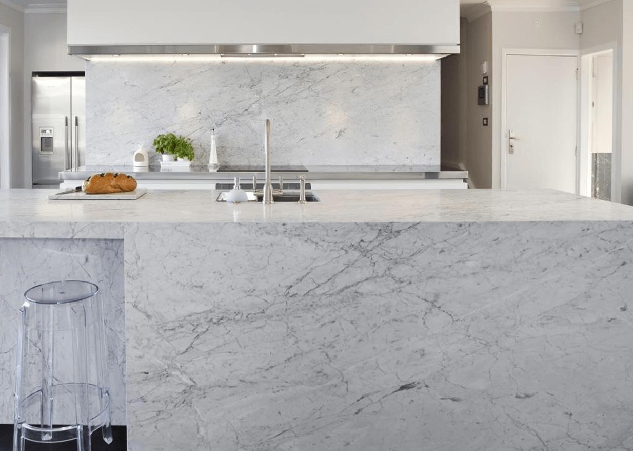 Close up of Carrara Marble with intricate veining and white background