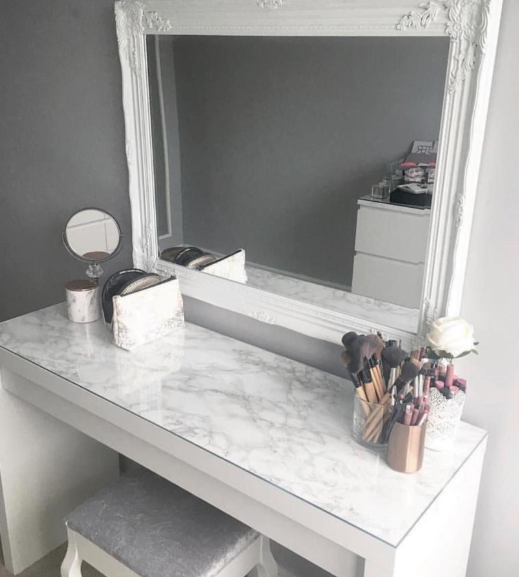 Modern white Ikea vanity table with mirror and drawers for makeup and beauty routine