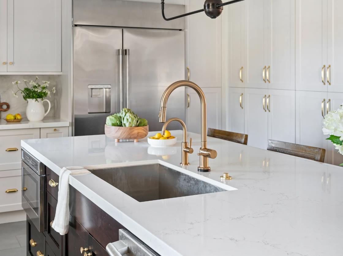 A luxurious white marble countertop in a modern kitchen.