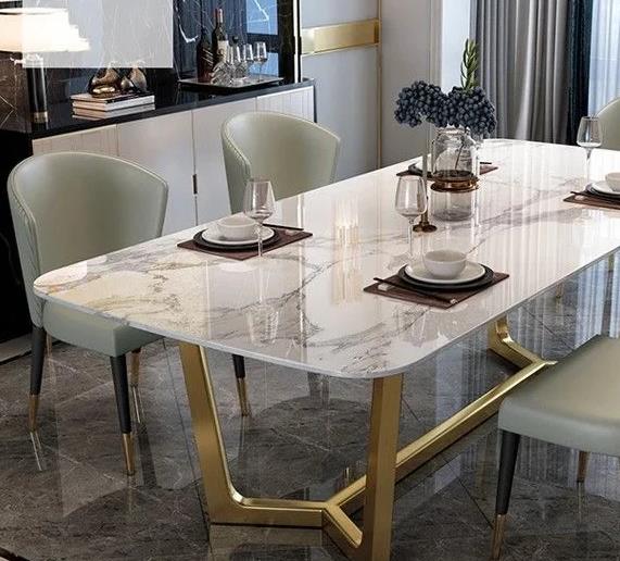 A luxurious marble dining table with elegant design and smooth surface.