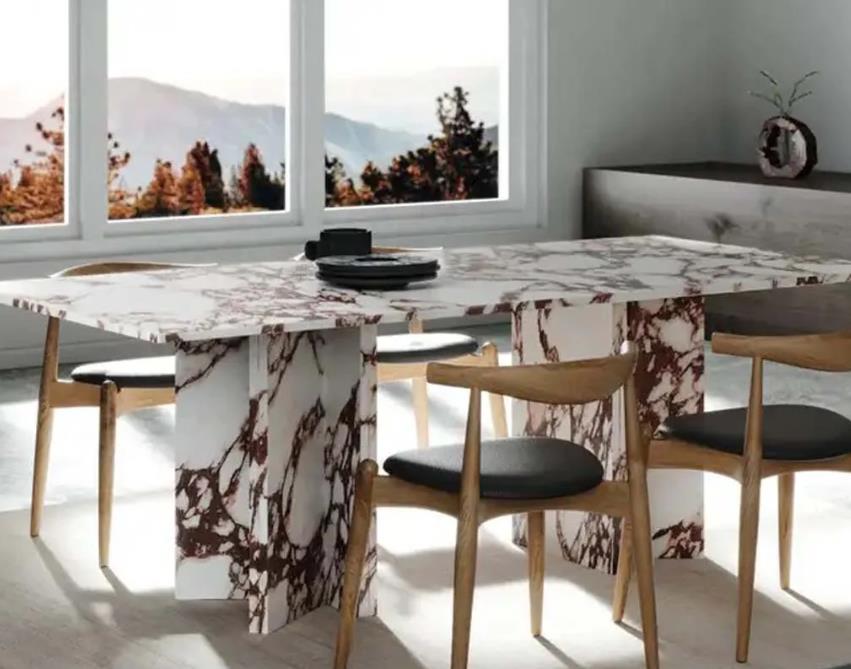 A luxurious marble top dining table with elegant design and sturdy construction.