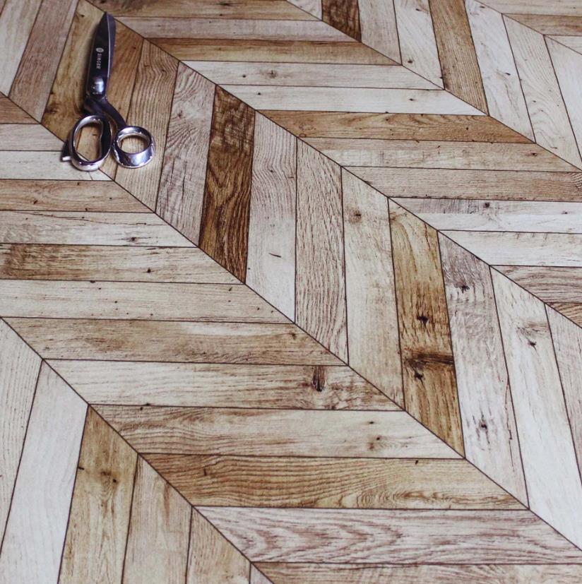 Parquet floor with intricate geometric pattern in a room