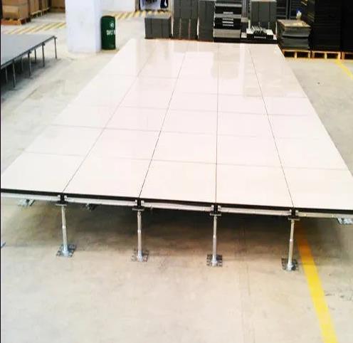 Raised floor pedestal system for supporting flooring panels
