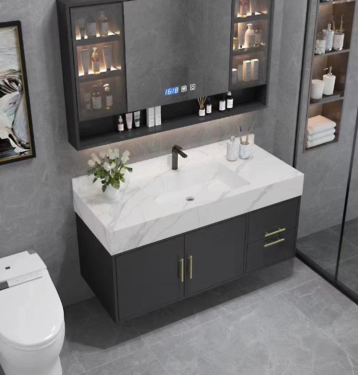 A modern white vanity cabinet with a marble countertop and silver hardware