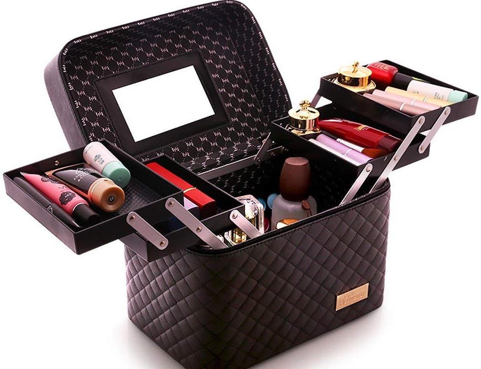 A black leather vanity case with gold hardware and a mirror inside