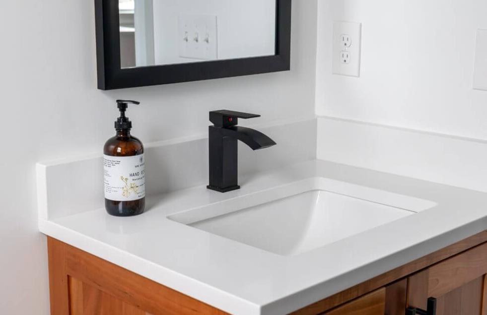 A sleek and modern vanity countertop with a marble finish