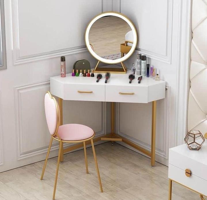 A white vanity dresser with a mirror and drawers, perfect for storing makeup and accessories.