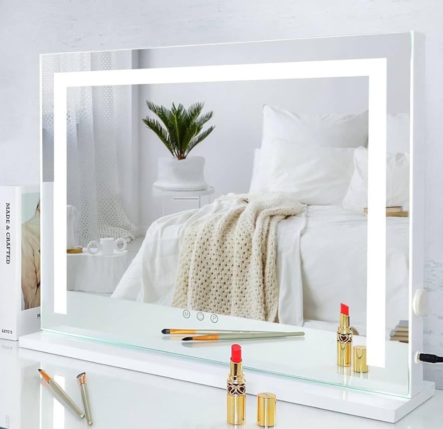 Vanity mirror with lights reflecting a bright and illuminated image.