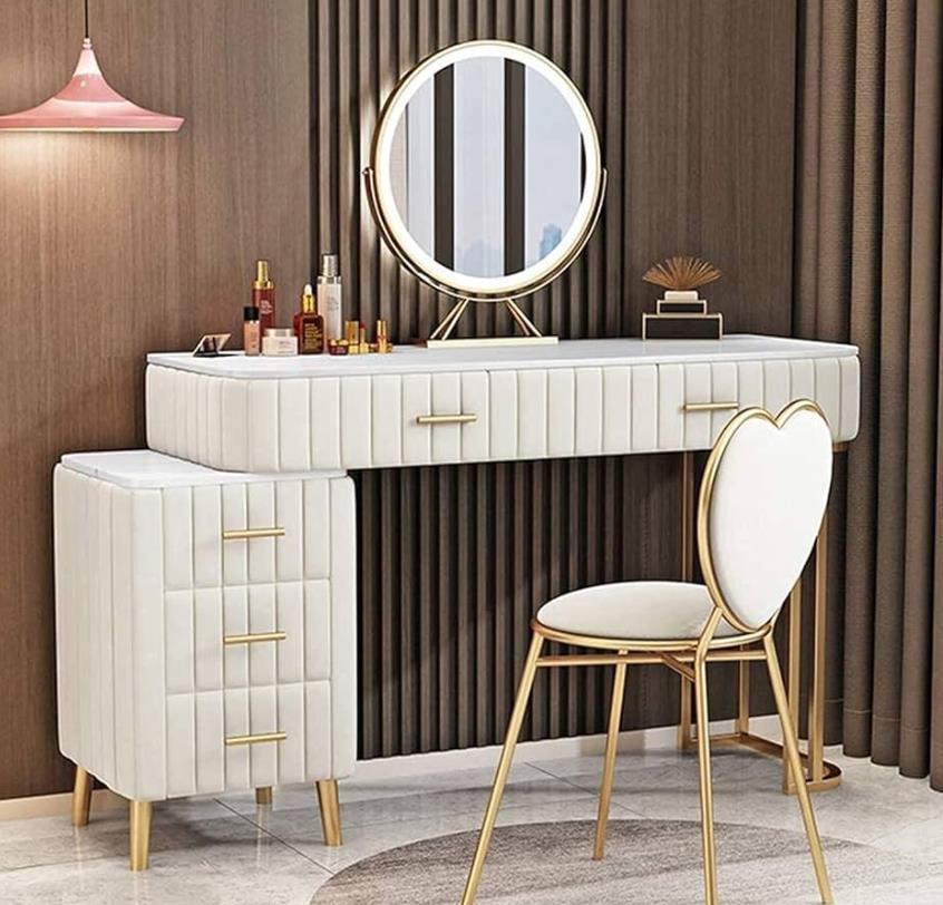 A vanity table with a mirror, featuring a sleek design and elegant finish.