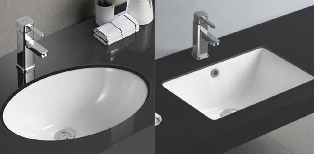 White marble washbasin countertop with modern faucet and soap dispenser