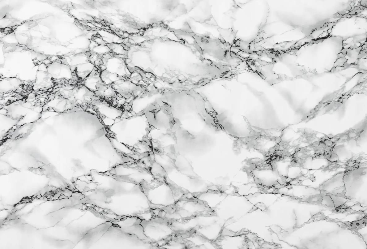Close-up of white marble texture with natural veining and patterns