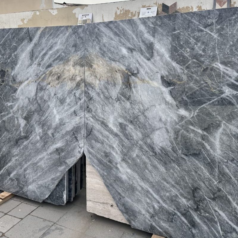 Grey Ocean Marble (Ocean Grey Marble) slab in dark grey tone with natural flowing light veining, polished glossy surface.